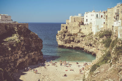 Panoramic view of sea and buildings against sky