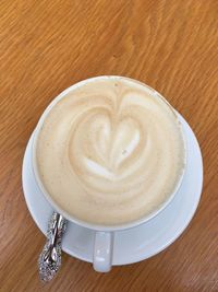 High angle view of cappuccino on table