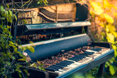 Close-up of abandoned piano