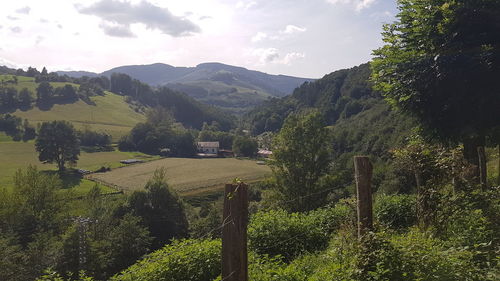 Scenic view of landscape and mountains against sky