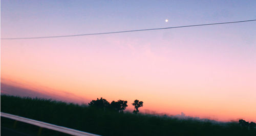 Scenic view of landscape at sunset