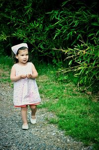 Portrait of young woman in grass