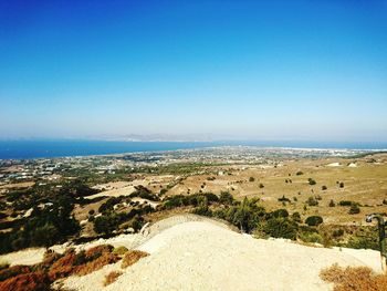 Scenic view of sea against clear blue sky