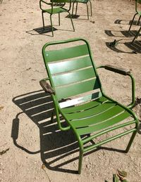 High angle view of empty chairs in back yard