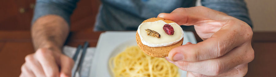 Midsection of man holding ice cream