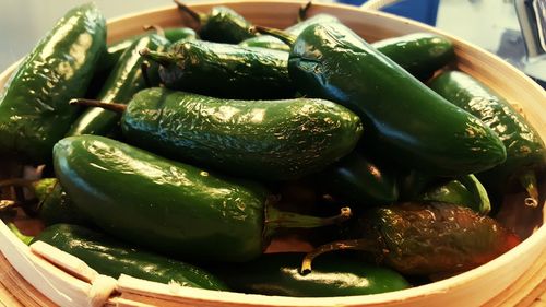 Close-up of cooked red chili peppers in container