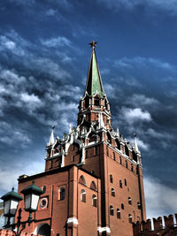 Low angle view of building against cloudy sky