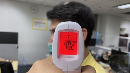 Close-up of hand holding text