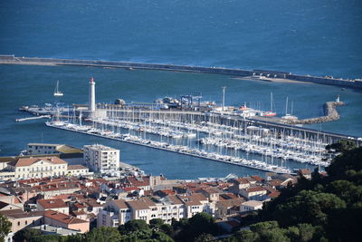 High angle view of harbor by sea against sky