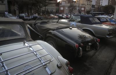 Vehicles on road along buildings