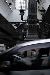 Low angle view of sculpture on street in city