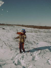 Full length of person on snow covered land