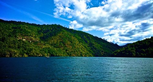 Scenic view of lake with mountains in background