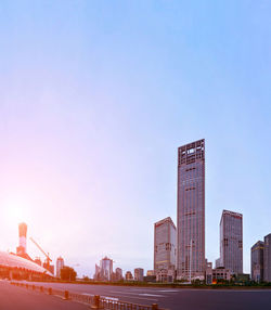 Low angle view of skyscrapers against blue sky