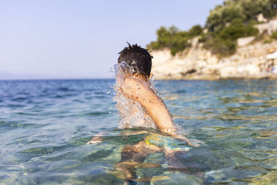 Man swimming in sea