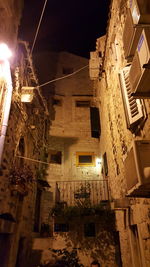 Low angle view of illuminated building at night