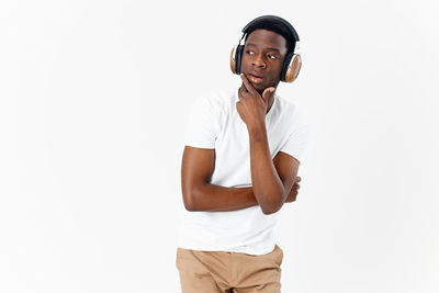 Man looking away against white background