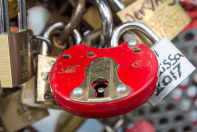 Close-up of padlocks on rusty metal