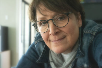 Close-up portrait of smiling mid adult woman