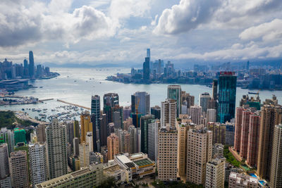 Aerial view of modern buildings in city against sky