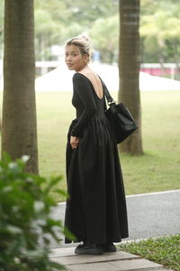 Low section of woman with dog