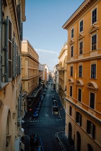 High angle view of street amidst buildings against sky in city