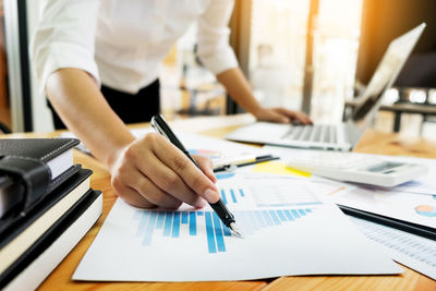 Close-up of man working on table