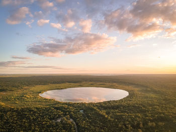 Sunset over el mirador sian ka'an waterhole located south of tulum, mexico, seen from the air