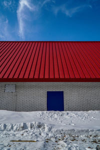 Red roof against sky