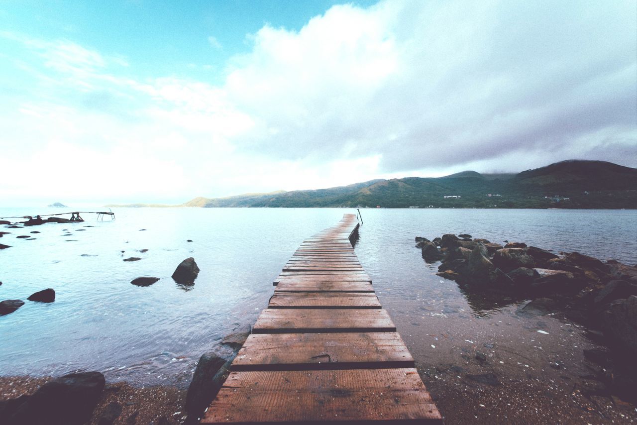 the way forward, water, sky, pier, tranquil scene, tranquility, boardwalk, diminishing perspective, scenics, jetty, beauty in nature, nature, wood - material, cloud - sky, lake, sea, vanishing point, idyllic, long, cloud