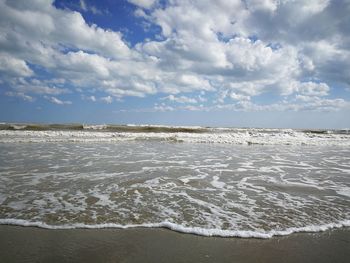 Scenic view of beach against sky