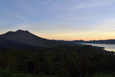 Scenic view of mountains against sky during sunset