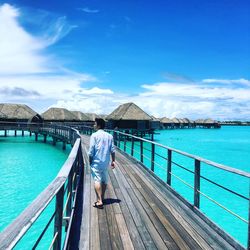 Man walking on pier