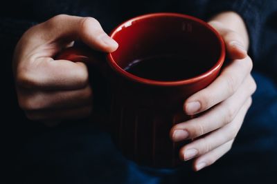 Close-up of hand holding drink