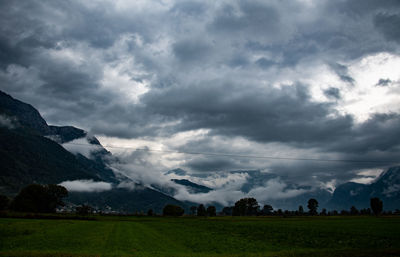 Scenic view of landscape against cloudy sky