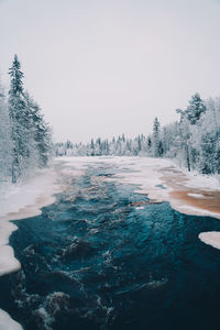 Scenic view of frozen lake against clear sky