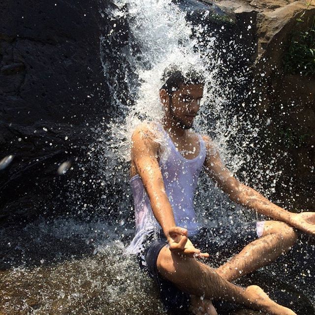 water, lifestyles, leisure activity, motion, splashing, high angle view, enjoyment, surf, person, low section, wet, men, sunlight, barefoot, fun, sea, day