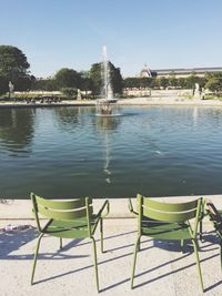 Empty bench in water