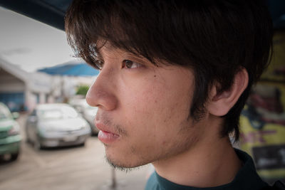 Portrait of young man looking away