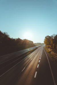 Empty road against clear sky