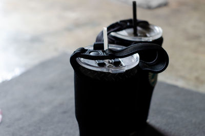 High angle view of black coffee cup on land