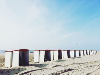 Sand dune on beach against sky