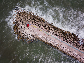 High angle view of lounge chair by sea