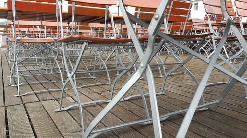 Close-up of chairs on table