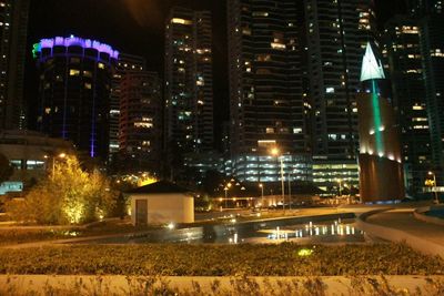 Modern buildings in city at night