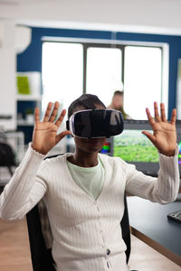 Woman wearing virtual reality simulator