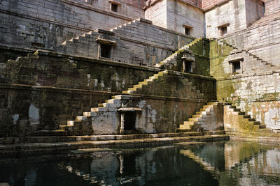 Reflection of old building in water