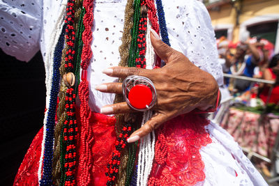 Midsection of woman wearing traditional clothing