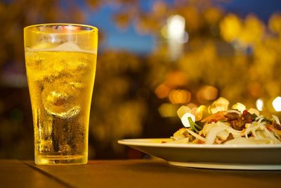 Close-up of food with drink served on table