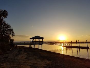 Scenic view of beach against sky during sunset